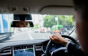 man driving tesla