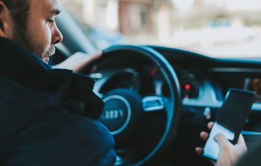 Man driving distracted on phone